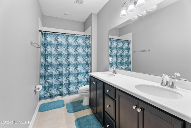 bathroom featuring tile patterned floors, walk in shower, vanity, a textured ceiling, and toilet