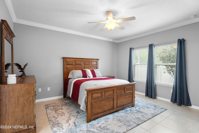 bedroom with ceiling fan, crown molding, light tile patterned floors, and a textured ceiling