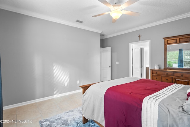 bedroom featuring a textured ceiling, ceiling fan, ornamental molding, and light tile patterned flooring