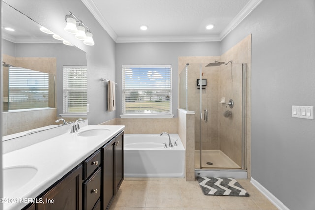 bathroom with tile patterned floors, ornamental molding, vanity, a textured ceiling, and independent shower and bath