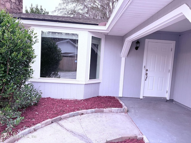 property entrance featuring a patio