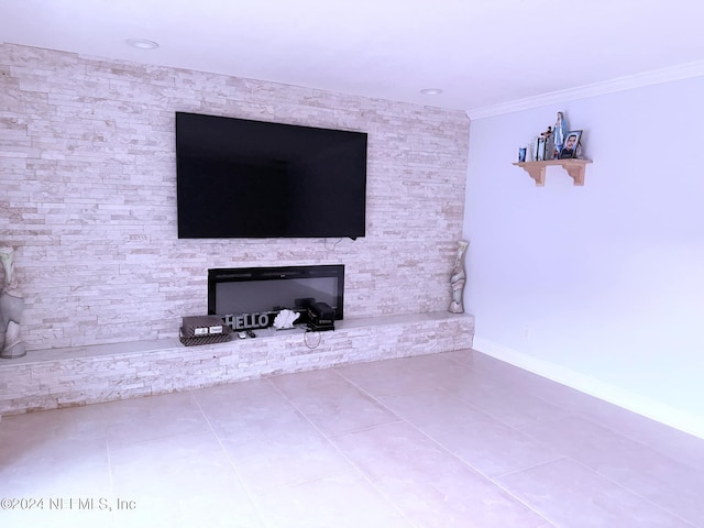 unfurnished living room featuring tile patterned floors and ornamental molding