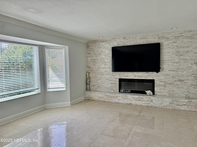 11050 Oak Ridge Dr N, Jacksonville, FL 32225 - unfurnished living room featuring baseboards, a textured ceiling, crown molding, and a stone fireplace