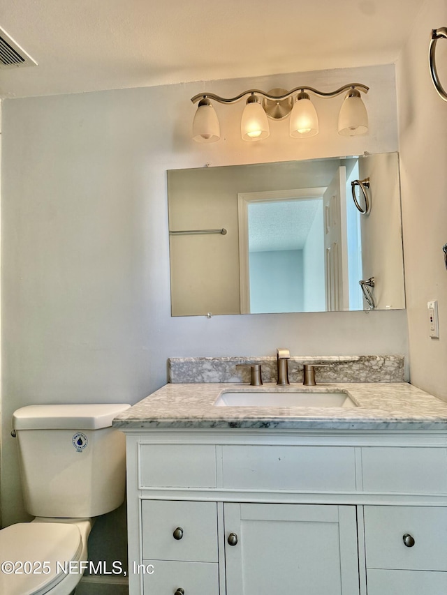 11050 Oak Ridge Dr N, Jacksonville, FL 32225 - bathroom with visible vents, toilet, and vanity