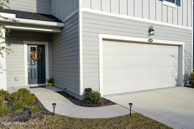 property entrance with a garage