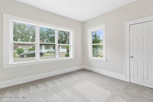 unfurnished room with carpet flooring