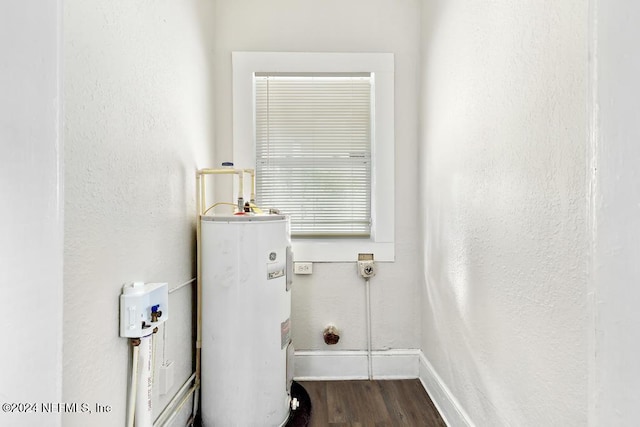 interior space featuring dark hardwood / wood-style floors and water heater