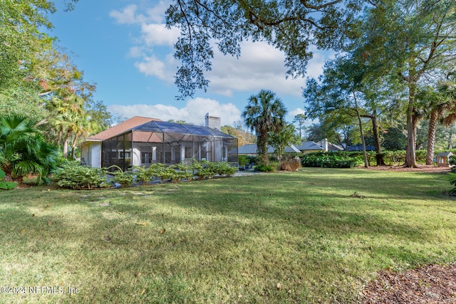 view of yard featuring a lanai