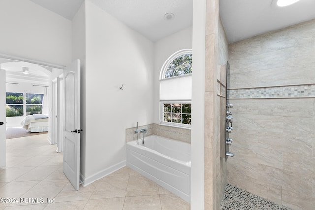 bathroom with plus walk in shower and tile patterned floors