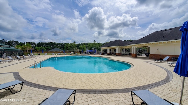 view of swimming pool featuring a patio