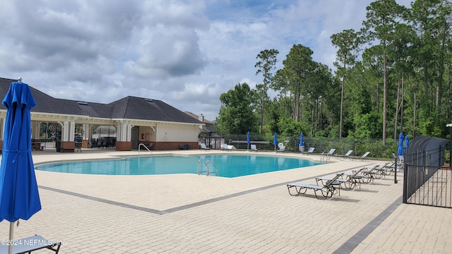 view of swimming pool featuring a patio