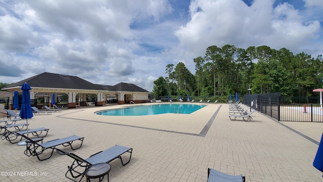 view of swimming pool featuring a patio area