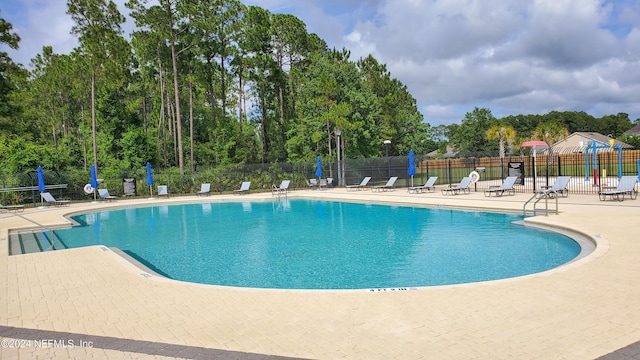 view of swimming pool featuring a patio area