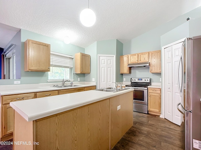 kitchen with sink, dark hardwood / wood-style flooring, pendant lighting, a kitchen island with sink, and appliances with stainless steel finishes