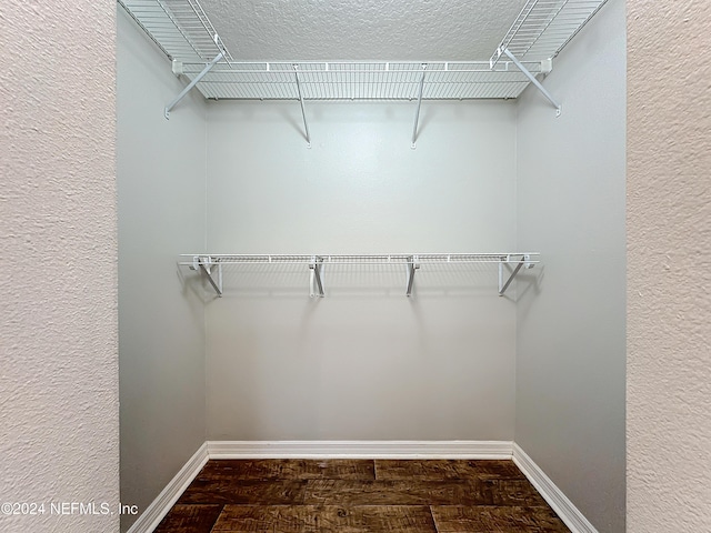 walk in closet featuring hardwood / wood-style flooring