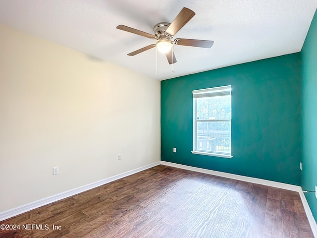 spare room with ceiling fan, a textured ceiling, and hardwood / wood-style flooring