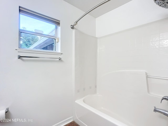 bathroom with shower / washtub combination