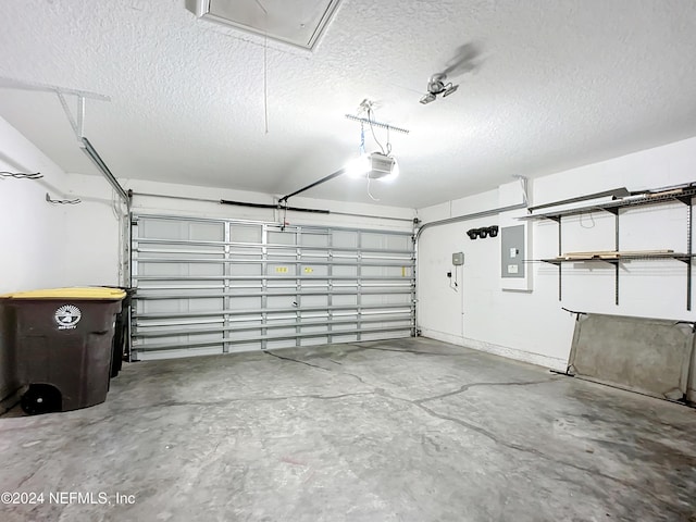 garage featuring a garage door opener and electric panel