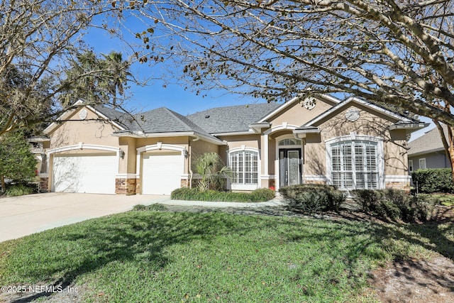 ranch-style house featuring a front yard and a garage