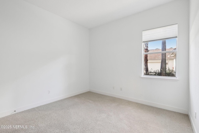 spare room featuring carpet floors