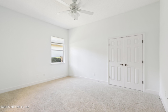 unfurnished room with carpet floors and ceiling fan