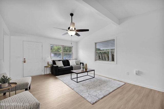 living room featuring lofted ceiling with beams, light hardwood / wood-style floors, and ceiling fan