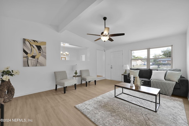 living room featuring ceiling fan with notable chandelier, vaulted ceiling with beams, and light hardwood / wood-style floors