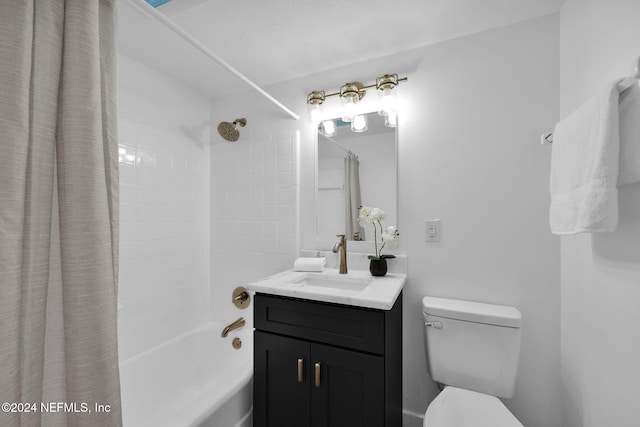 full bathroom featuring shower / bath combo with shower curtain, vanity, and toilet