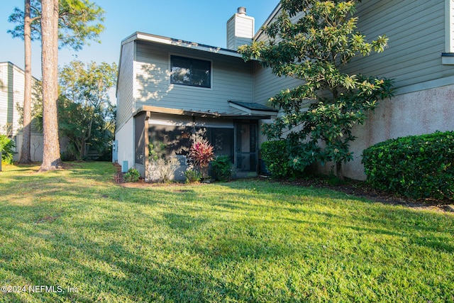 view of front of home with a front lawn