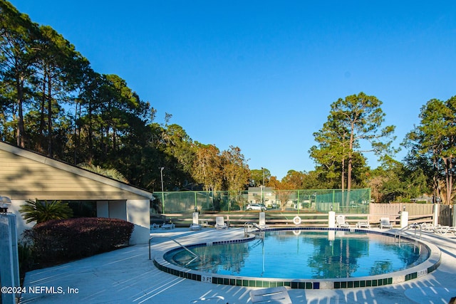 view of swimming pool with a patio area