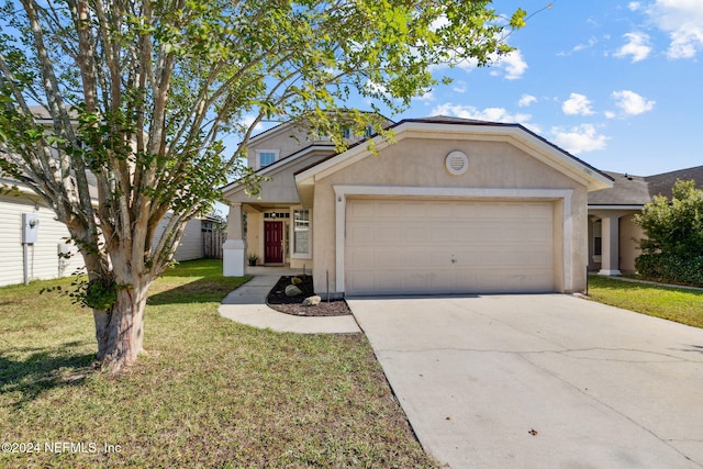 single story home featuring a front lawn and a garage