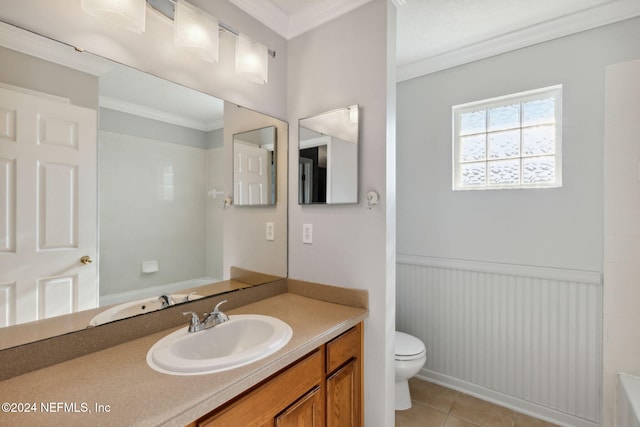 bathroom with tile patterned floors, crown molding, vanity, and toilet