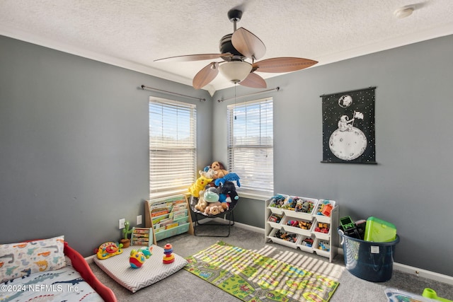 carpeted bedroom featuring ceiling fan, crown molding, and a textured ceiling