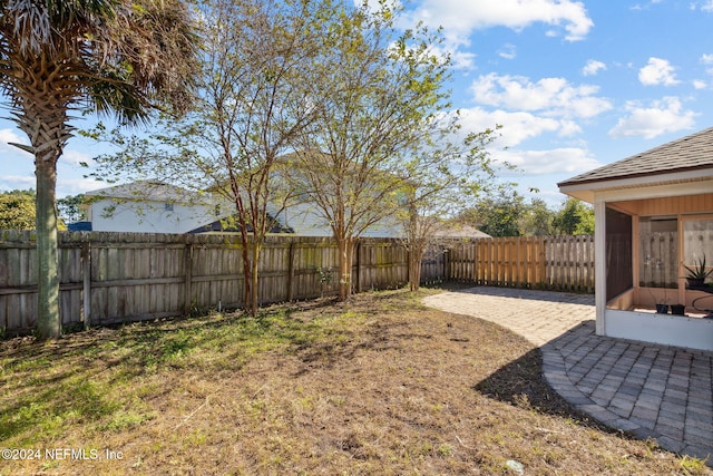 view of yard featuring a sunroom