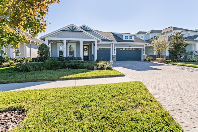 view of front of home with a front yard and covered porch