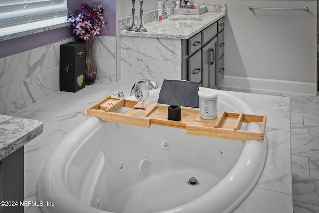 bathroom featuring vanity and a bathtub