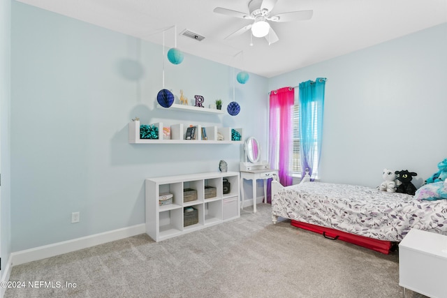 bedroom with ceiling fan and carpet floors