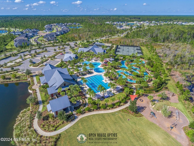 birds eye view of property with a water view