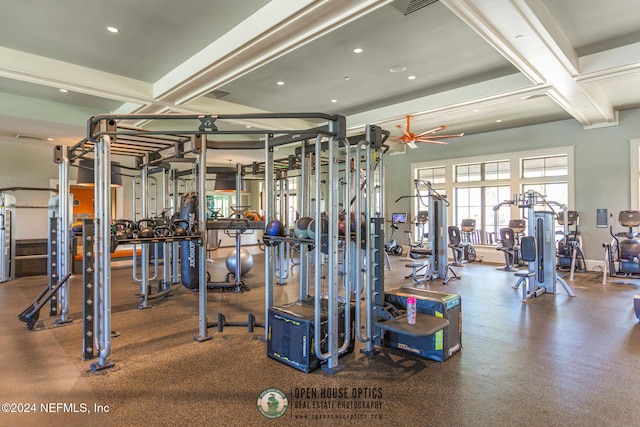 gym with ceiling fan and coffered ceiling