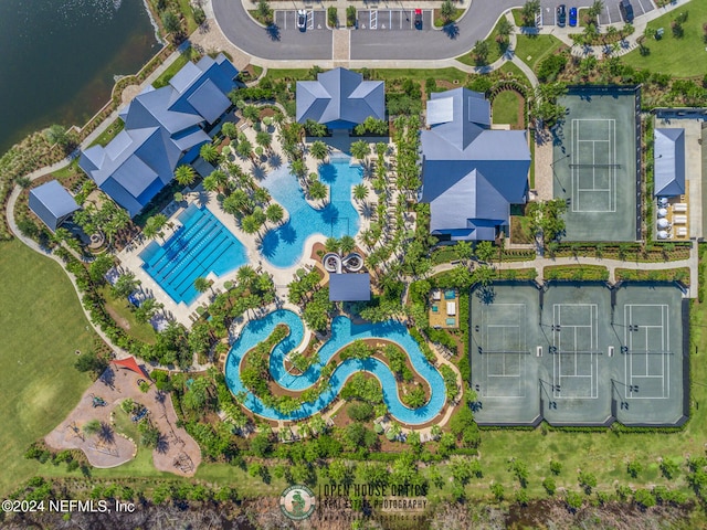 birds eye view of property with a water view