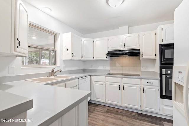 kitchen featuring black appliances, sink, white cabinetry, and dark wood-type flooring