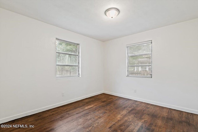 empty room featuring dark hardwood / wood-style floors