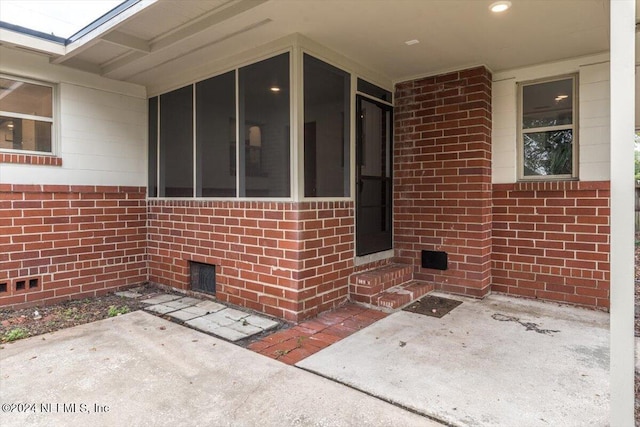 doorway to property featuring a patio