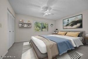 bedroom featuring ceiling fan and a closet