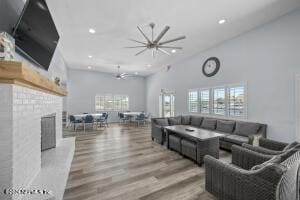 living room featuring wood-type flooring and a towering ceiling