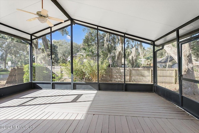 unfurnished sunroom featuring vaulted ceiling and ceiling fan