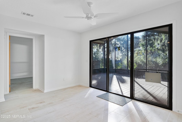 empty room featuring ceiling fan and a textured ceiling