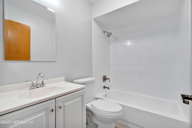 full bathroom with washtub / shower combination, vanity, and toilet