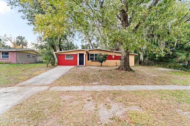 ranch-style house with a front lawn