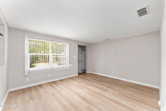 empty room with light hardwood / wood-style floors